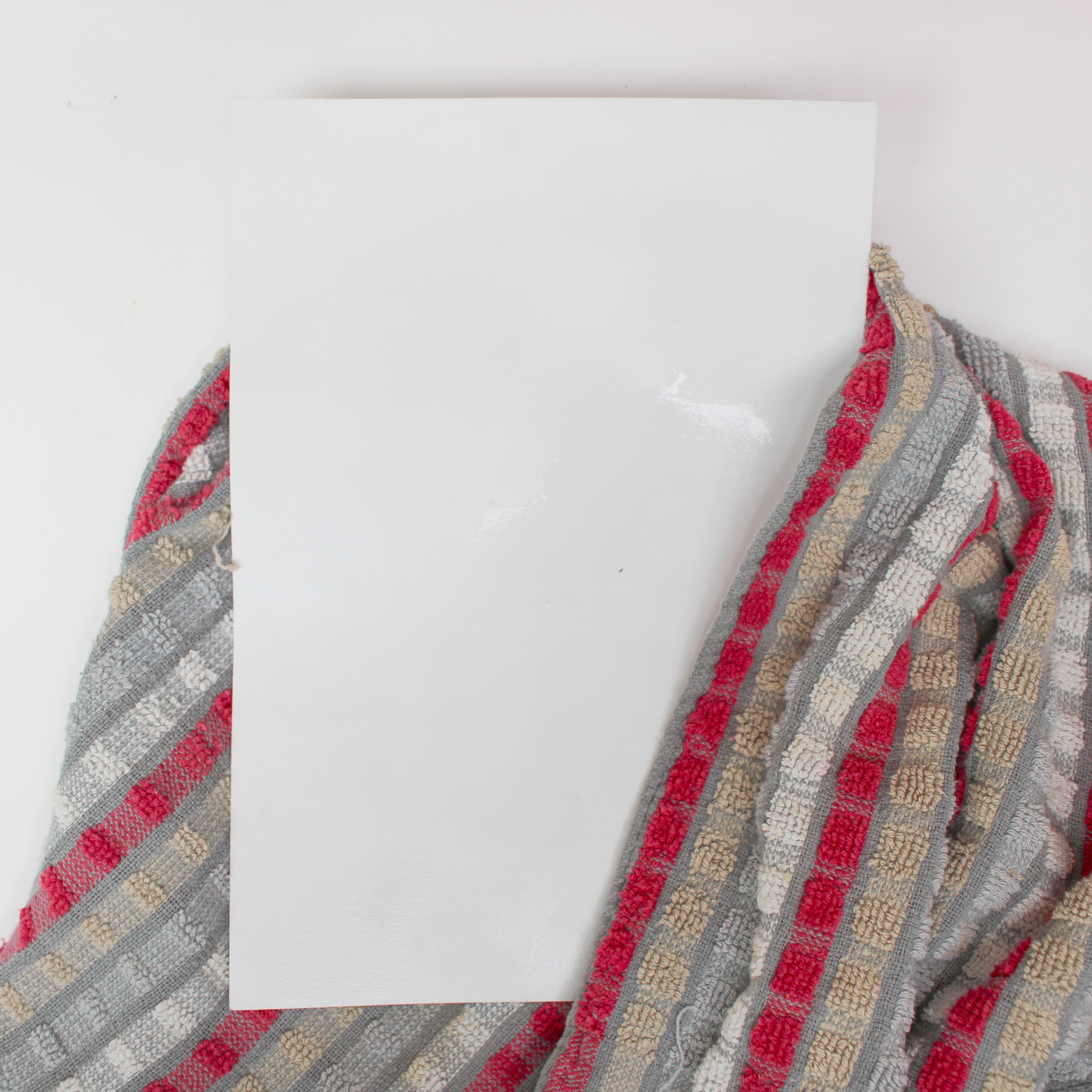 Removing surplus water from paper